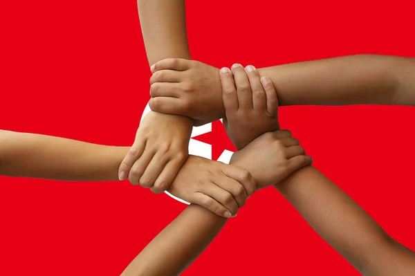 Tunisia flag, intergration of a multicultural group of young people — Stock Photo, Image