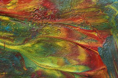 Mermer bir arka planda akrilik boya ve yağ karışımının makro çekimi.