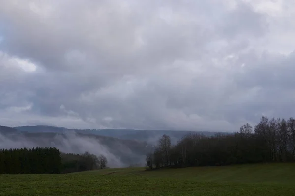 Landscape photo in rainy weather with fog and clouds in spring.