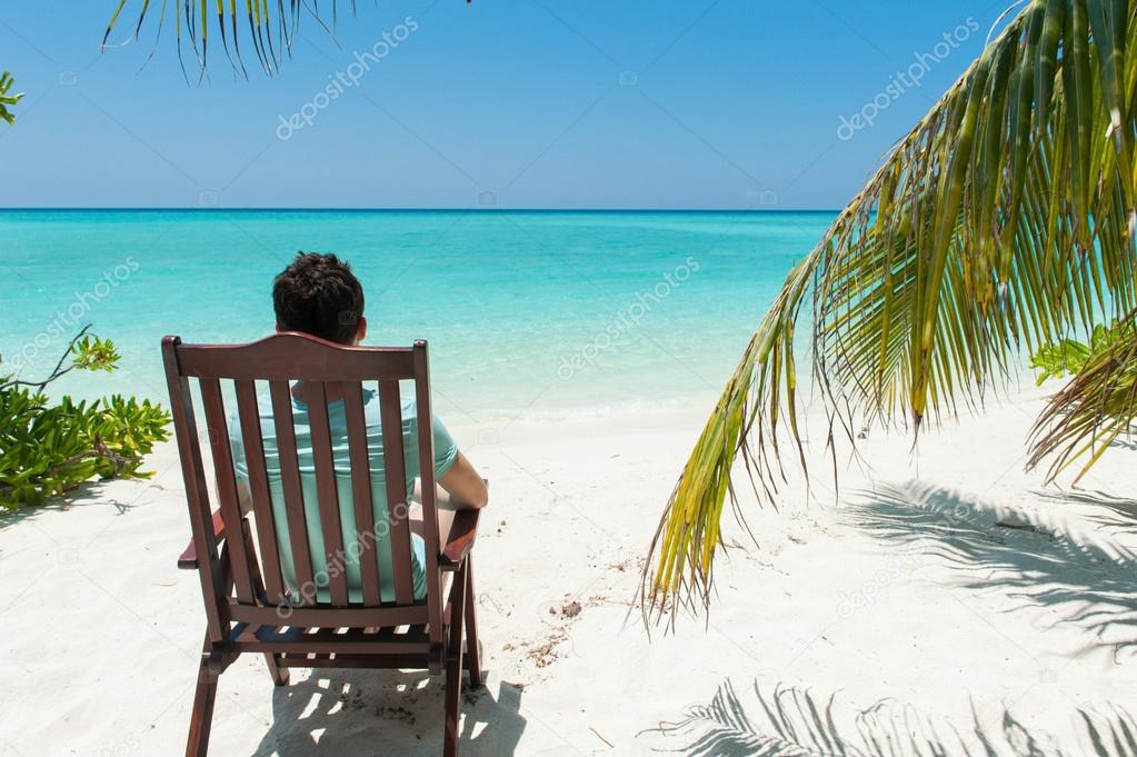 Man relaxing on chair