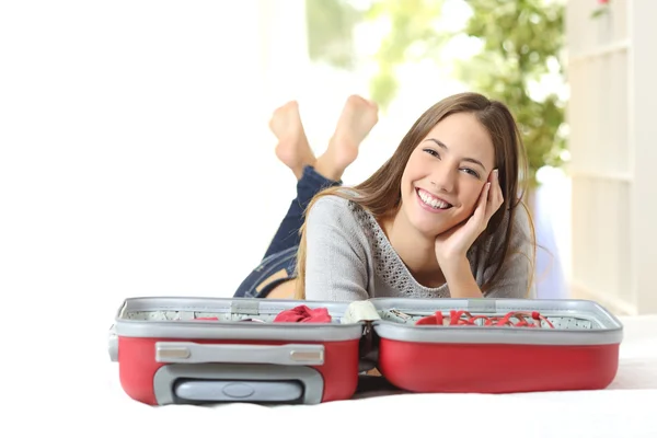 Happy woman planning a travel — Stock Photo, Image
