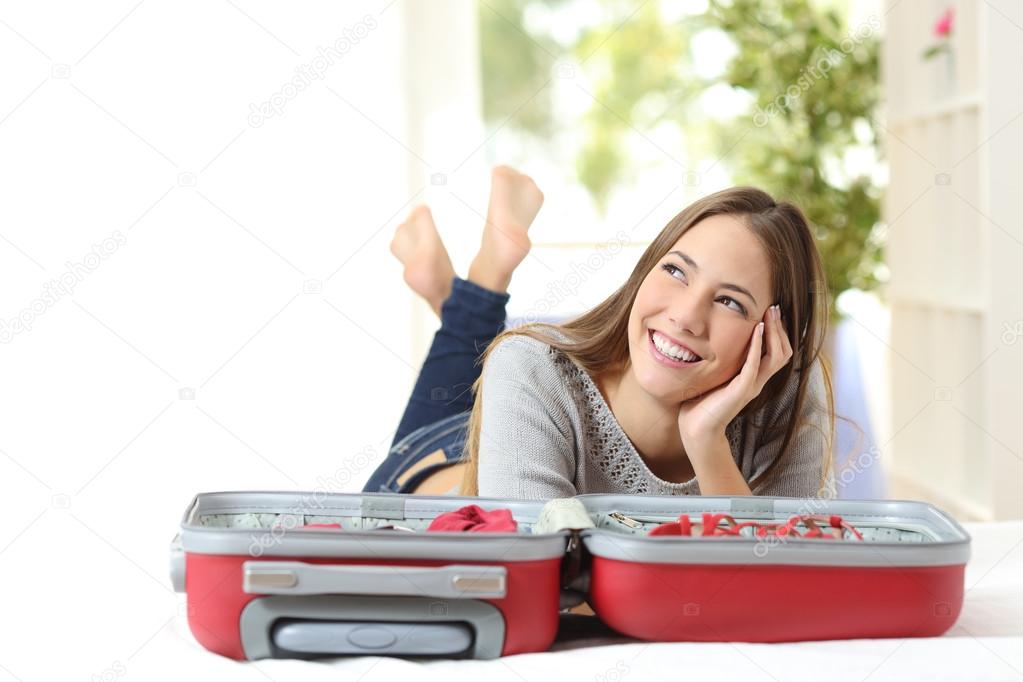 Woman thinking and preparing a travel