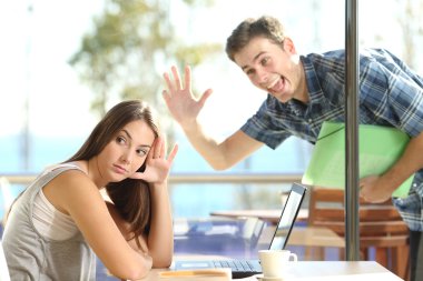 Girl ignoring a stalker man waving clipart