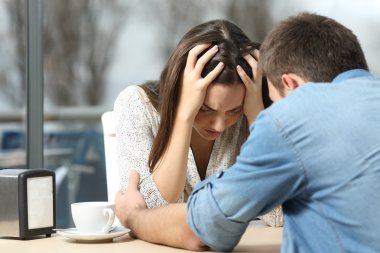 Man comforting a sad depressed girl clipart