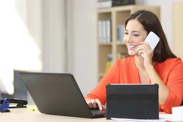 Entrepreneur working with multiple devices