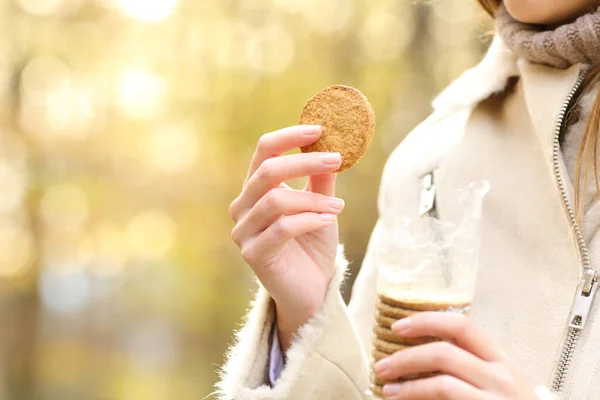 Close Woman Hand Holding Cookie Package Ready Eat Autumn Park — Stock Photo, Image