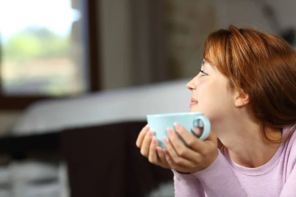 Side View Portrait Woman Holding Coffee Cup Contemplating Bedroom — Stock Photo, Image