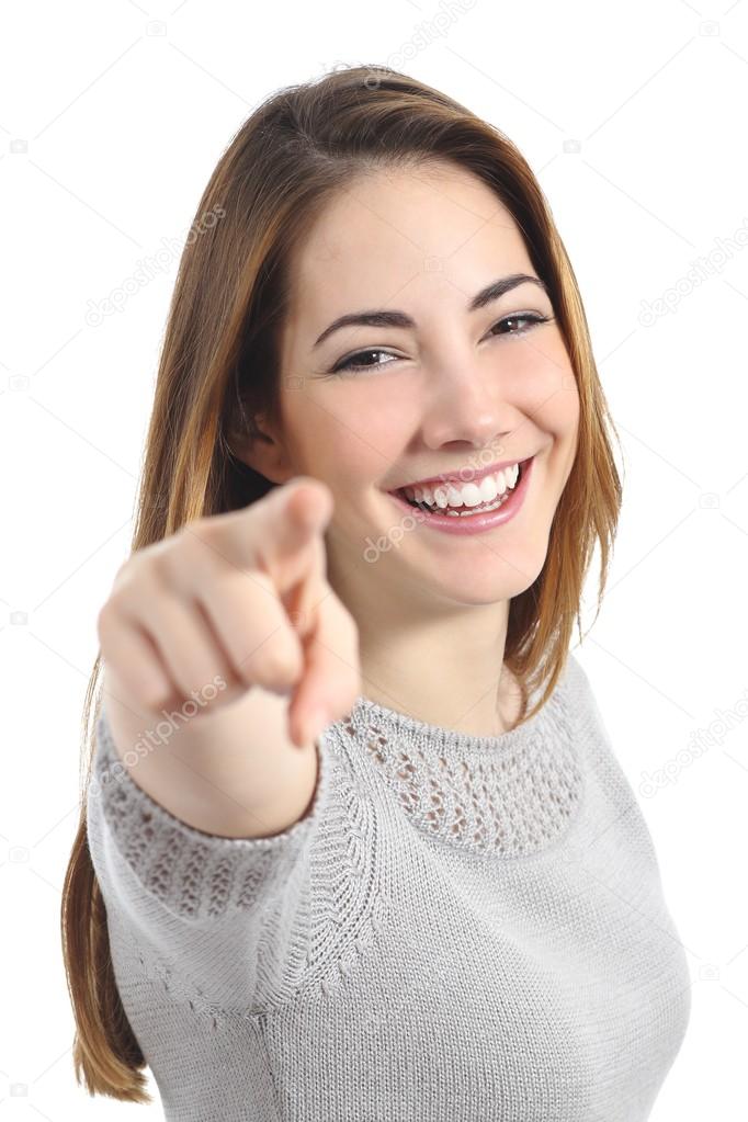 Funny teenager girl with white smile pointing at you