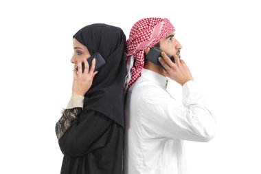 Distant arab couple calling on the phone clipart
