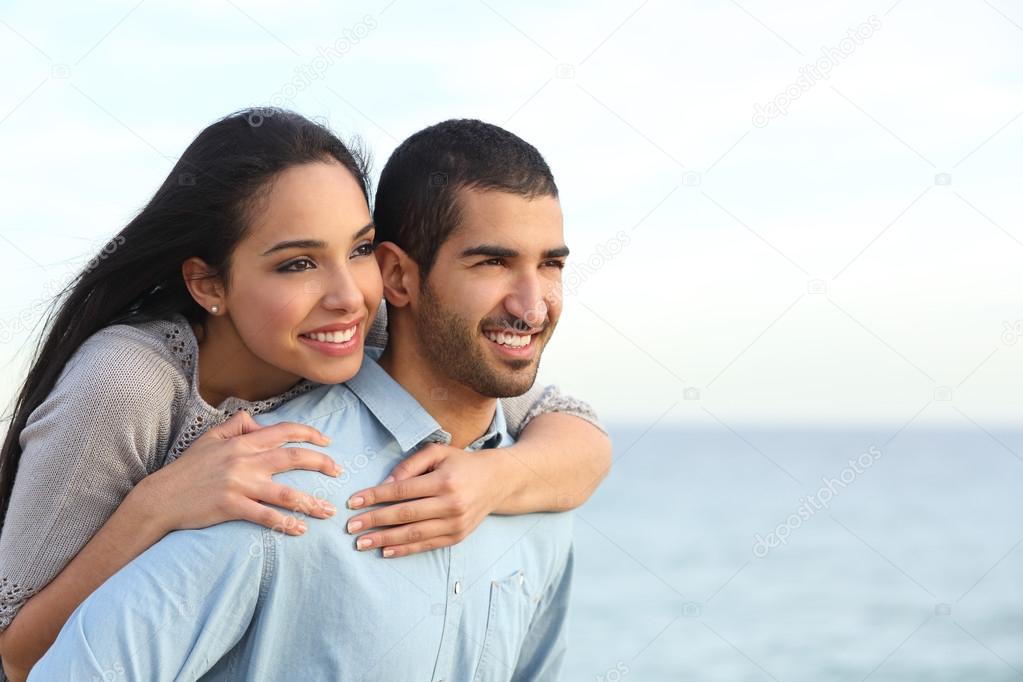Arab couple flirting in love on the beach