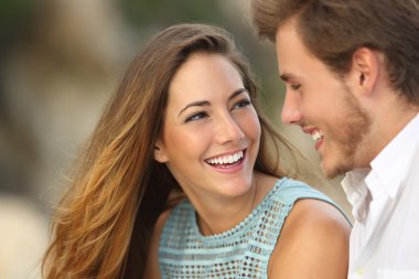 Funny couple laughing with a white perfect smile clipart