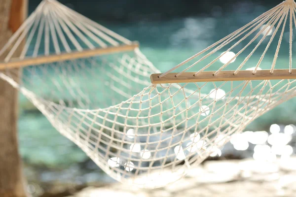 Hammock on a tropical beach resort vacation concept — Stock Photo, Image