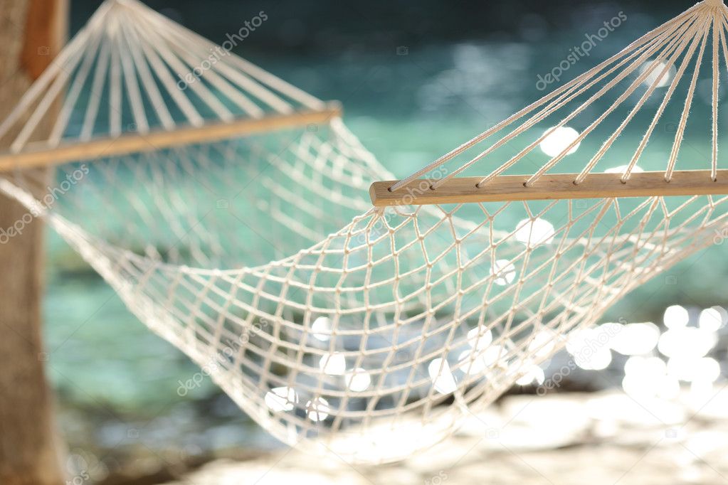 Hammock on a tropical beach resort vacation concept