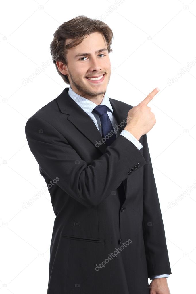 Young happy business man pointing at side