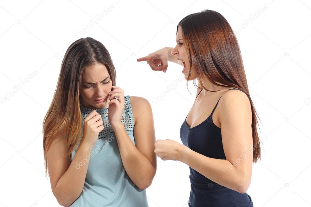 Angry woman abusing of another scared one