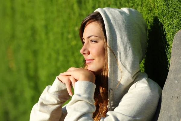 Side view portrait of a pensive teenager skater girl thinking — Stock Photo, Image