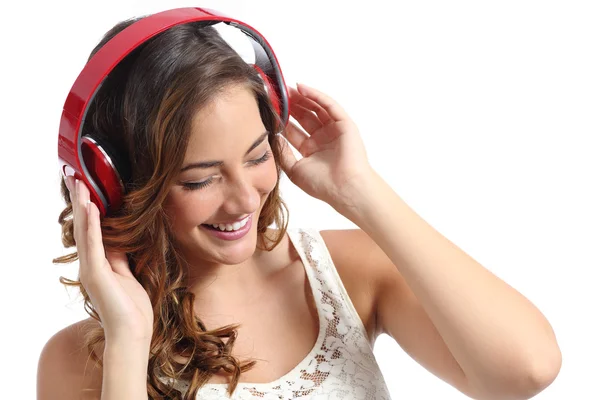 Joven mujer feliz disfrutando escuchando la música de los auriculares —  Fotos de Stock