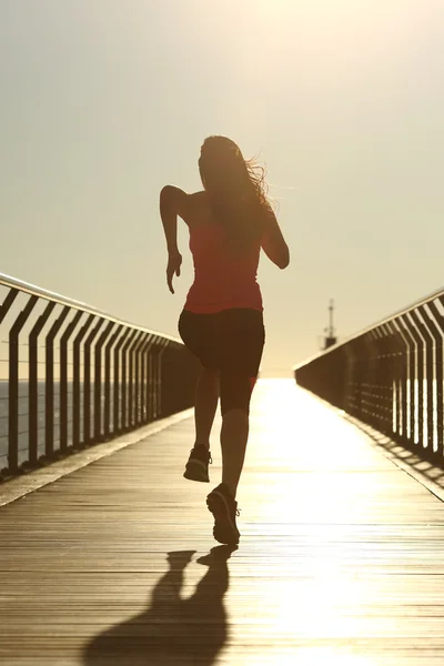 Runner silhouette running fast at sunset — Stock Photo, Image