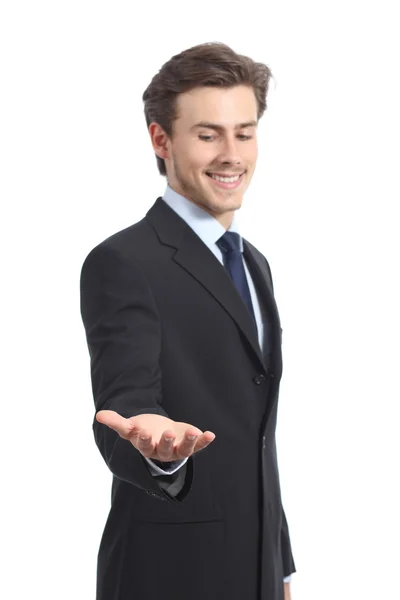 Feliz hombre de negocios sosteniendo algo o un producto en blanco — Foto de Stock