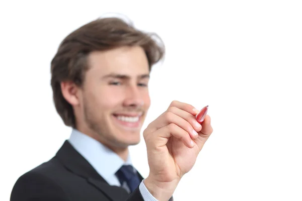Happy affärsman skriver i luften med en penna — Stockfoto