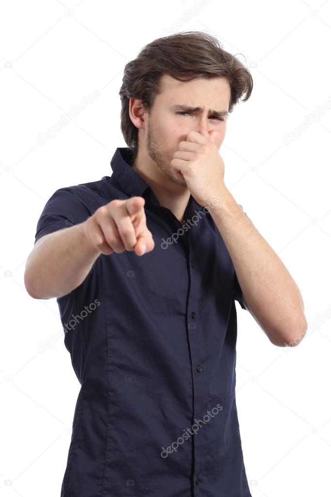 Man pointing at you with hand holding nose because bad stink