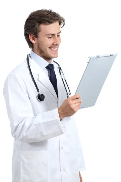 Young happy doctor man reading a medical history — Stock Photo, Image