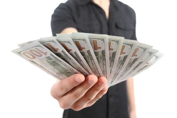 Close up van een man hand bieden geld bankbiljetten — Stockfoto