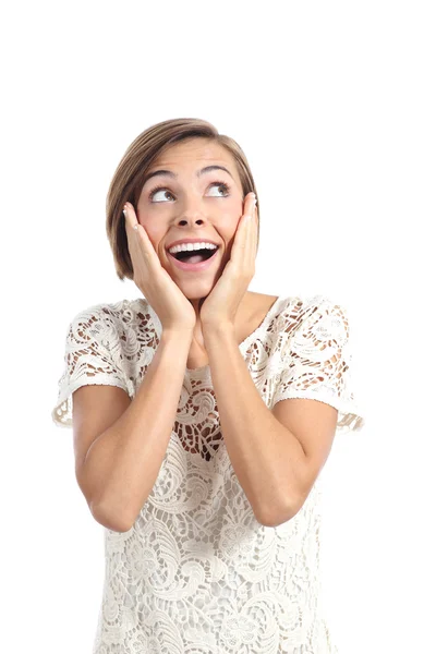 Happy shocked woman looking at side with hands on face — Stock Photo, Image