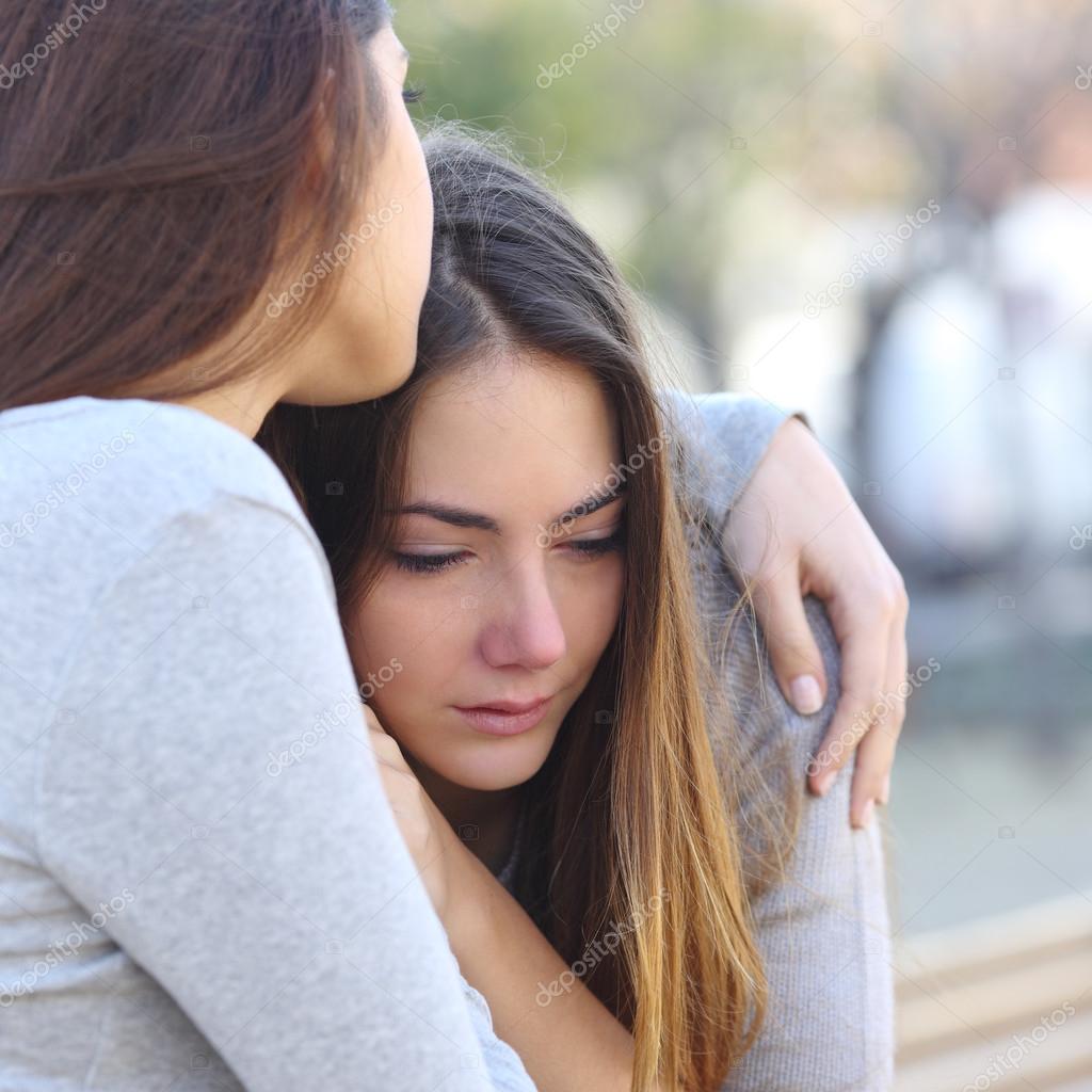 Sad girl crying and a friend comforting her Stock Photo by ...