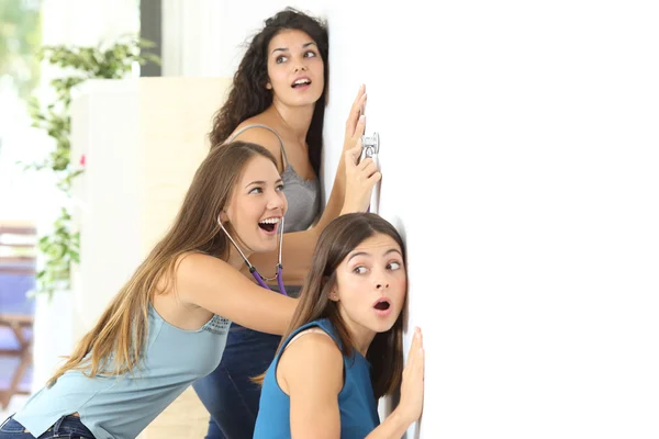 Gossip girls listening to the neighbour — Stock Photo, Image