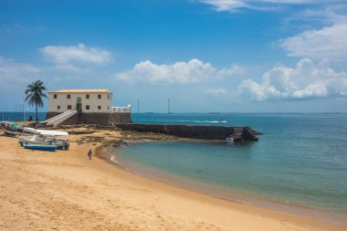 View of the beautiful and famous Porto da Barra beach with Saint Mary Fort (Forte de Santa Maria) in the distance - Salvador, Bahia, Brazil