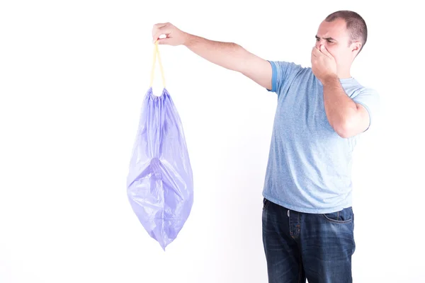 Man with a stinking garbage — Stock Photo, Image