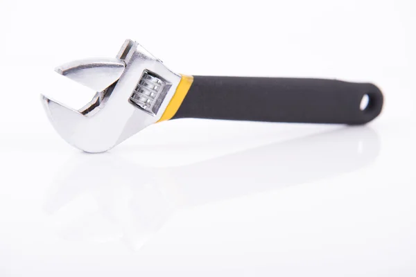 Black and yellow wrench — Stock Photo, Image