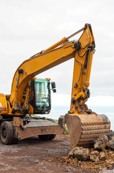 One orange excavator — Stock Photo, Image