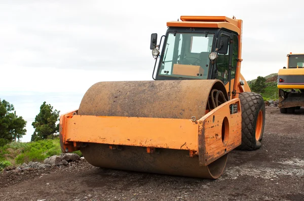 One orange steamroller — Stock Photo, Image