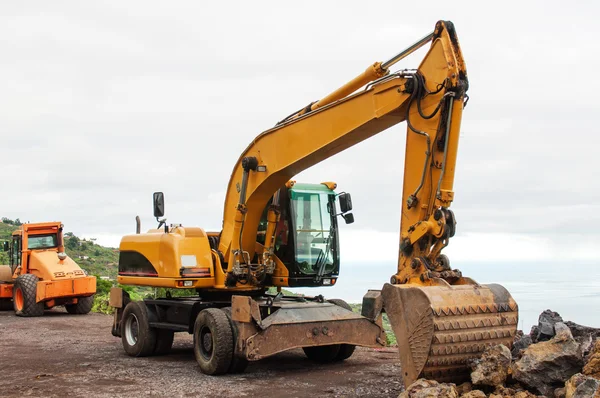 One orange excavator — Stock Photo, Image