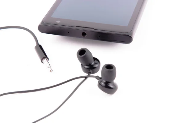 Smartphone con auriculares — Foto de Stock
