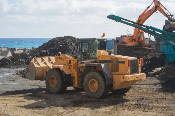 Bulldozer in a quarry — Stock Photo, Image