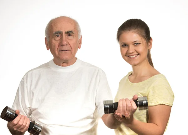 Old man and young woman are doing sport — Stock Photo, Image