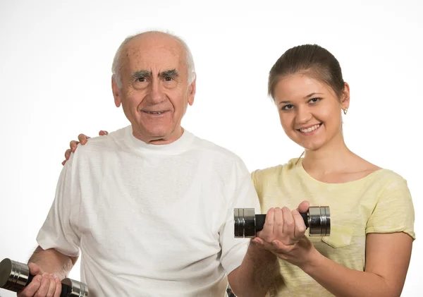 Old man and young woman are doing sport — Stock Photo, Image