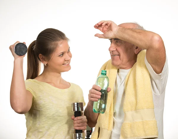 Vecchio e giovane donna stanno facendo sport — Foto Stock