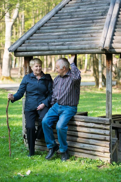 Older people sitting in the arbor — Stock Photo, Image