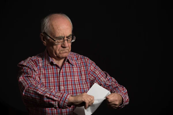 old man with bank document