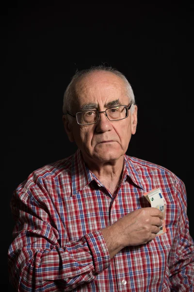 Elderly man with money — Stock Photo, Image