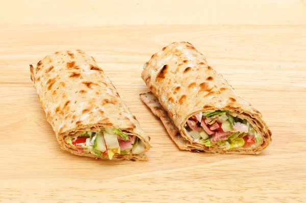 Sandwich wraps on a board — Stock Photo, Image