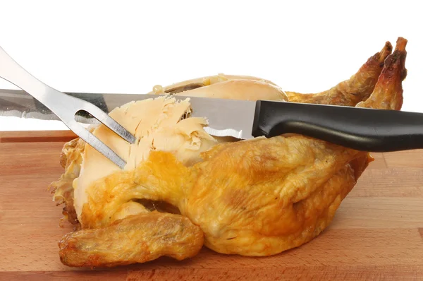 Roast chicken  with  carving knife — Stock Photo, Image