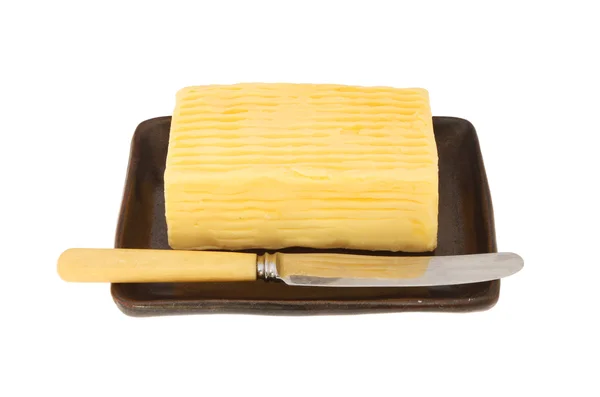 Block of butter and butter knife — Stock Photo, Image