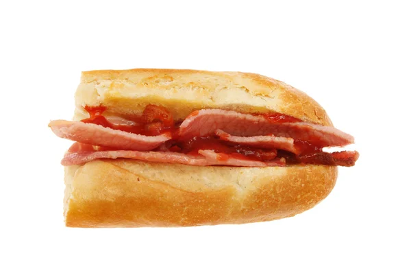 Bacon baguette with ketchup — Stock Photo, Image