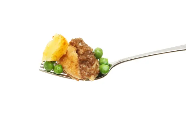 Meat pie and veg on fork — Stock Photo, Image