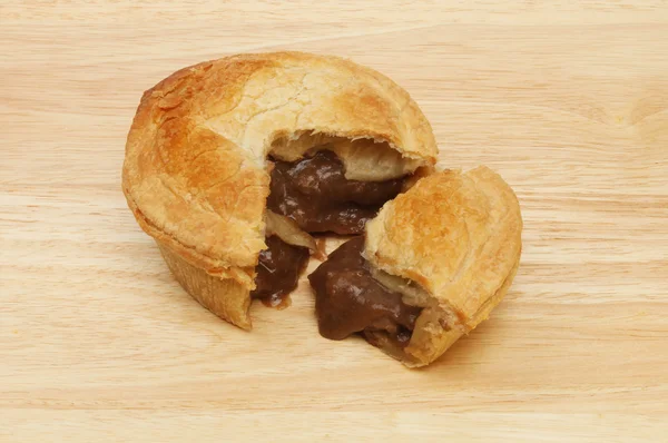 Steak pie on a wooden board — Stock Photo, Image